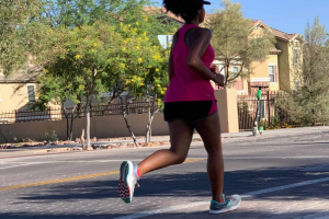 Breanna running on sidewalk